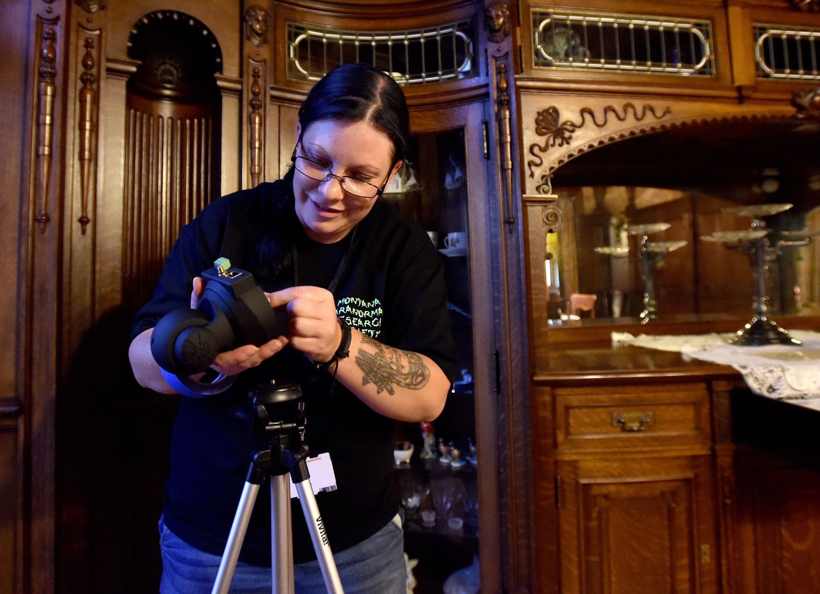 Robbie Blakely sets up a dining room camera